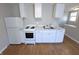 Clean white kitchen with a stove, fridge, and plenty of cabinet space at 726 E Mccarty St, Indianapolis, IN 46203