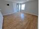 Bright living area with wood floors, a large window, and ample space at 726 E Mccarty St, Indianapolis, IN 46203
