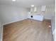 Open-concept living area with wood floors and a well-lit kitchen at 726 E Mccarty St, Indianapolis, IN 46203