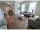 Spacious living room featuring hardwood floors, neutral walls, and an open floor plan to the dining area at 726 E Mccarty St, Indianapolis, IN 46203