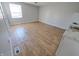 Well-lit living room featuring wood-look floors and an open layout at 726 E Mccarty St, Indianapolis, IN 46203