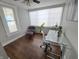 Office with glass desk, two chairs and hardwood floors with natural light from the window at 726 E Mccarty St, Indianapolis, IN 46203