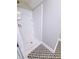 Shower with neutral colored walls, patterned flooring, and a built-in shelf at 726 E Mccarty St, Indianapolis, IN 46203