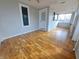 Bright sunroom with hardwood floors, white trim, and multiple windows providing ample natural light at 726 E Mccarty St, Indianapolis, IN 46203