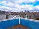 Roof deck with city skyline view and surrounding neighborhood homes at 726 E Mccarty St, Indianapolis, IN 46203