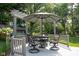 Back deck with large umbrella and table, perfect for outdoor dining at 7971 Clearwater Ct, Indianapolis, IN 46256
