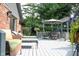 Back deck with lounge seating and dining table, providing outdoor enjoyment at 7971 Clearwater Ct, Indianapolis, IN 46256