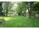 Enjoy the privacy of a lush backyard perfect for recreation and relaxation with a canopy of mature trees at 7971 Clearwater Ct, Indianapolis, IN 46256
