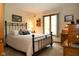 Bedroom with black iron bed frame and light neutral walls at 7971 Clearwater Ct, Indianapolis, IN 46256
