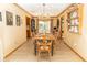 The open dining room features a large table set for eight with decorative touches and natural light at 7971 Clearwater Ct, Indianapolis, IN 46256