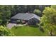 Charming brick home with a well-maintained lawn, landscaping, and an attached two-car garage at 7971 Clearwater Ct, Indianapolis, IN 46256