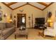 Cozy living room with vaulted ceilings, exposed beams, and comfortable seating at 7971 Clearwater Ct, Indianapolis, IN 46256