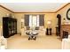 Cozy living room featuring a fireplace, plush seating, and classic decor at 7971 Clearwater Ct, Indianapolis, IN 46256