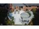 Aerial view of a well-furnished outdoor patio with seating, lounge chairs, flowers and dining area at 7971 Clearwater Ct, Indianapolis, IN 46256
