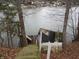 The backyard slopes down to the lake with a quaint storage shed at 8 Lake Hart, Mooresville, IN 46158