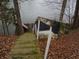 The backyard slopes down to the lake with a quaint storage shed at 8 Lake Hart, Mooresville, IN 46158
