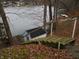 The backyard slopes down to the lake with a quaint storage shed at 8 Lake Hart, Mooresville, IN 46158