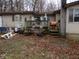 Backyard featuring a wooden deck with gardening supplies at 8 Lake Hart, Mooresville, IN 46158