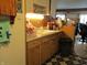 The kitchen shows a double basin sink, wood cabinets, and under cabinet lighting at 8 Lake Hart, Mooresville, IN 46158