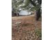 Spacious backyard with mature trees providing shade and privacy at 8833 Crawfordsville Rd, Indianapolis, IN 46234