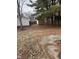 Fenced backyard featuring a storage shed and a concrete pad at 8833 Crawfordsville Rd, Indianapolis, IN 46234