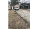 View of the gravel driveway leading up to the garage door at 8833 Crawfordsville Rd, Indianapolis, IN 46234