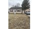 Charming single-story home with classic black shutters and a well-manicured front yard at 8833 Crawfordsville Rd, Indianapolis, IN 46234
