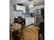 Compact kitchen with white cabinets and stainless steel appliances at 8833 Crawfordsville Rd, Indianapolis, IN 46234