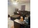 Comfortable living room featuring a large sofa and a ceiling fan at 8833 Crawfordsville Rd, Indianapolis, IN 46234