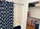 Bathroom shower with blue patterned shower curtain and closet at 8960 Stepping Stone Way, Avon, IN 46123
