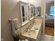 Bathroom with dual sinks and mirrors with access to bedroom at 8960 Stepping Stone Way, Avon, IN 46123