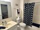 Bathroom featuring a vanity with marble countertop and blue patterned shower curtain at 8960 Stepping Stone Way, Avon, IN 46123