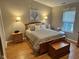Cozy bedroom with neutral walls, hardwood floors, and lots of natural light at 8960 Stepping Stone Way, Avon, IN 46123
