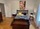 Well-lit bedroom with a wood floor, a comfortable bed and decor at 8960 Stepping Stone Way, Avon, IN 46123