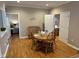 Dining area with wood floors, table with seating for four, and natural light at 8960 Stepping Stone Way, Avon, IN 46123