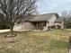 Charming brick home with an attached garage and a well-maintained lawn with mature trees at 8960 Stepping Stone Way, Avon, IN 46123