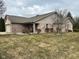 Landscaped front yard with brick exterior at 8960 Stepping Stone Way, Avon, IN 46123