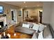Spacious living room with fireplace, an open dining area, and natural light at 8960 Stepping Stone Way, Avon, IN 46123