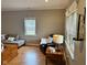 Cozy living room area with chair and a window with lots of natural light at 8960 Stepping Stone Way, Avon, IN 46123