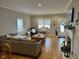 Spacious living room featuring a fireplace, ample seating, and plenty of natural light at 8960 Stepping Stone Way, Avon, IN 46123