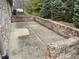 Enclosed patio with brick surround provides privacy and shade for outdoor enjoyment at 8960 Stepping Stone Way, Avon, IN 46123
