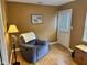 Cozy sitting area with a chair and natural light at 8960 Stepping Stone Way, Avon, IN 46123