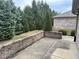 The back patio overlooks the verdant, tree-lined lawn at 8960 Stepping Stone Way, Avon, IN 46123