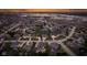 Stunning aerial view of a neighborhood with beautiful homes, lush greenery, and waterfront access to a lake at 10802 Giselle Way, Fishers, IN 46040