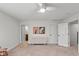 Neutral carpeted bedroom with ceiling fan and view of an adjacent bathroom at 10802 Giselle Way, Fishers, IN 46040