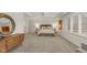 Spacious bedroom with tray ceiling, large windows, and neutral carpet flooring offers a peaceful retreat at 10802 Giselle Way, Fishers, IN 46040