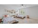 Bright bedroom featuring two beds, a window, and neutral carpeting at 10802 Giselle Way, Fishers, IN 46040