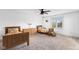 Bedroom with carpeted floors and two twin beds with orange floral accents at 10802 Giselle Way, Fishers, IN 46040