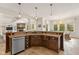 Open concept kitchen with granite countertops and stainless steel appliances at 10802 Giselle Way, Fishers, IN 46040