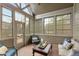 Inviting sunroom with natural light, cozy seating, and views of the outdoors at 10802 Giselle Way, Fishers, IN 46040